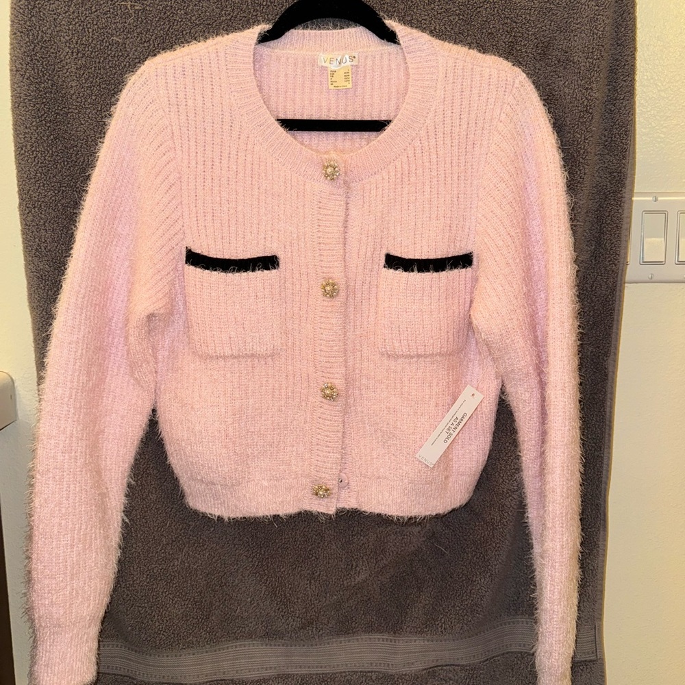 3 piece suit. Includes jacket, top, and skirt.